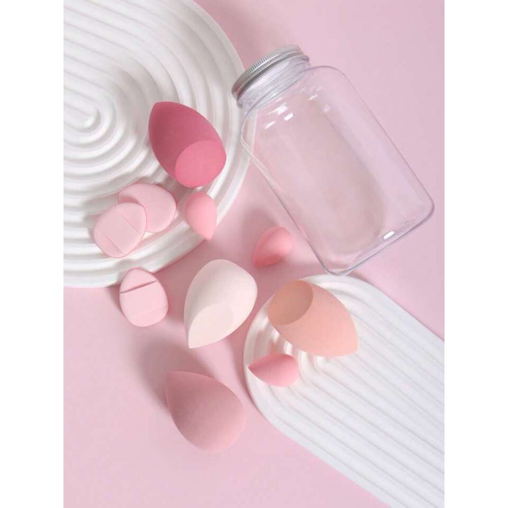 Clear jar with pink silicone applicators on a pink background