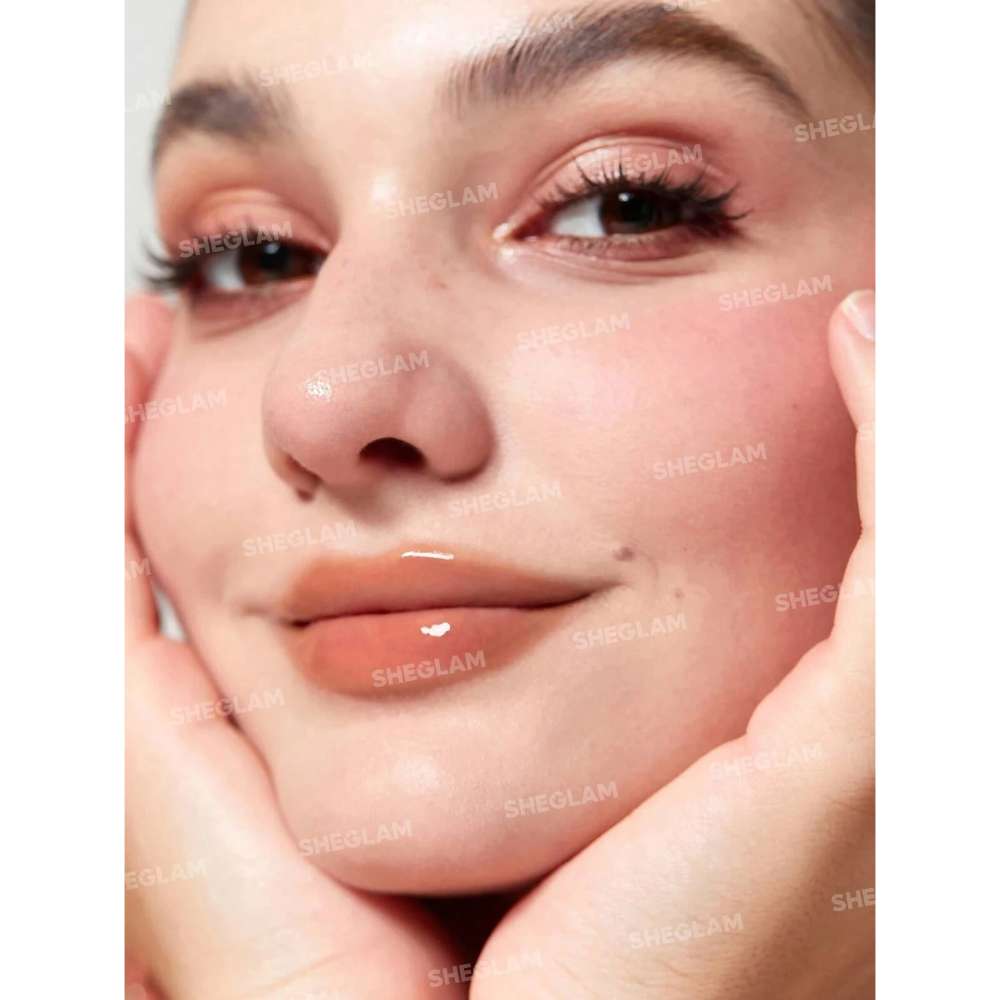Close-up of a person's face with visible pores and skin texture.