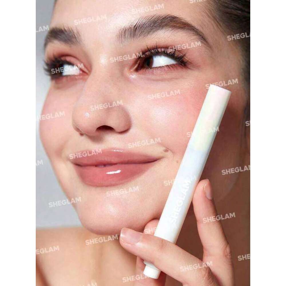 Woman applying a cosmetic product to her face with a applicator