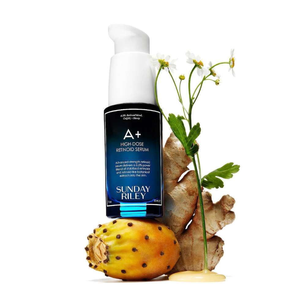 Sunday Riley A+ Hydrogel Retinoid Serum with a cactus and ginger root on a white background
