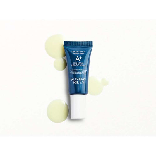 Blue skincare serum bottle with white cap on a white background